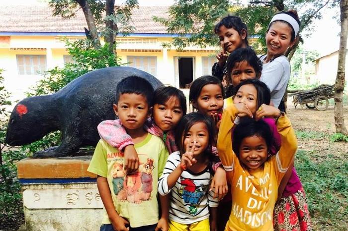 Lakhena Leang ’19 with local school children in one of Cambodia's provinces, Kampong Speu. She taught children how to properly wash their hands and brush their teeth, in addition to providing them with basic health checkups.