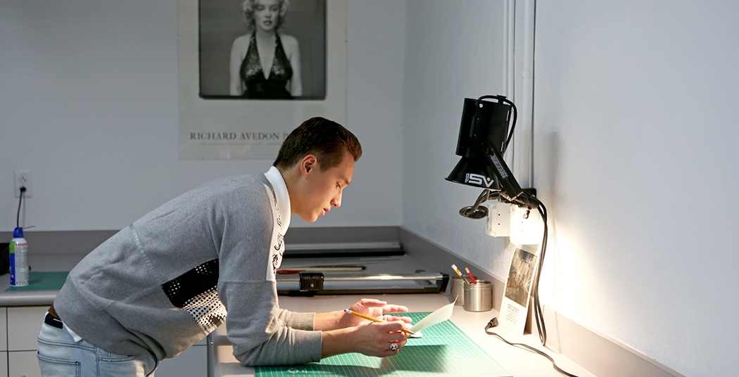 A student working in the photography studio in the Feigenbaum Center for Visual Arts