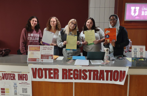 Students at voter registration table in Reamer