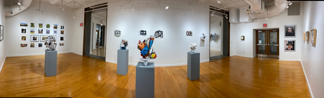 Wide angle photo of the Crowell and West galleries in the Feigenbaum Center for Visual Arts