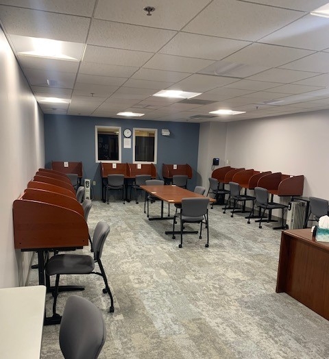 Image shows Accommodative Services' Testing Center with multiple carrels and tables for taking exams.