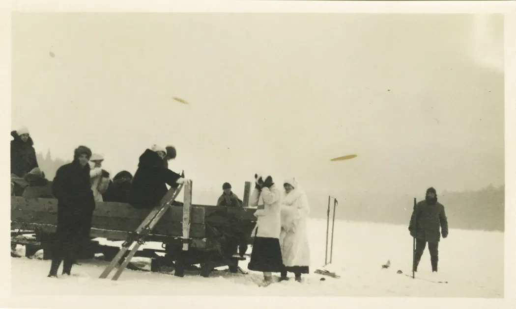 Photo of a group of skiers on a sled
