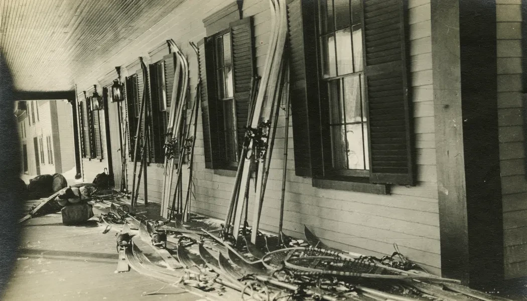 Photo of skis leaning against a building