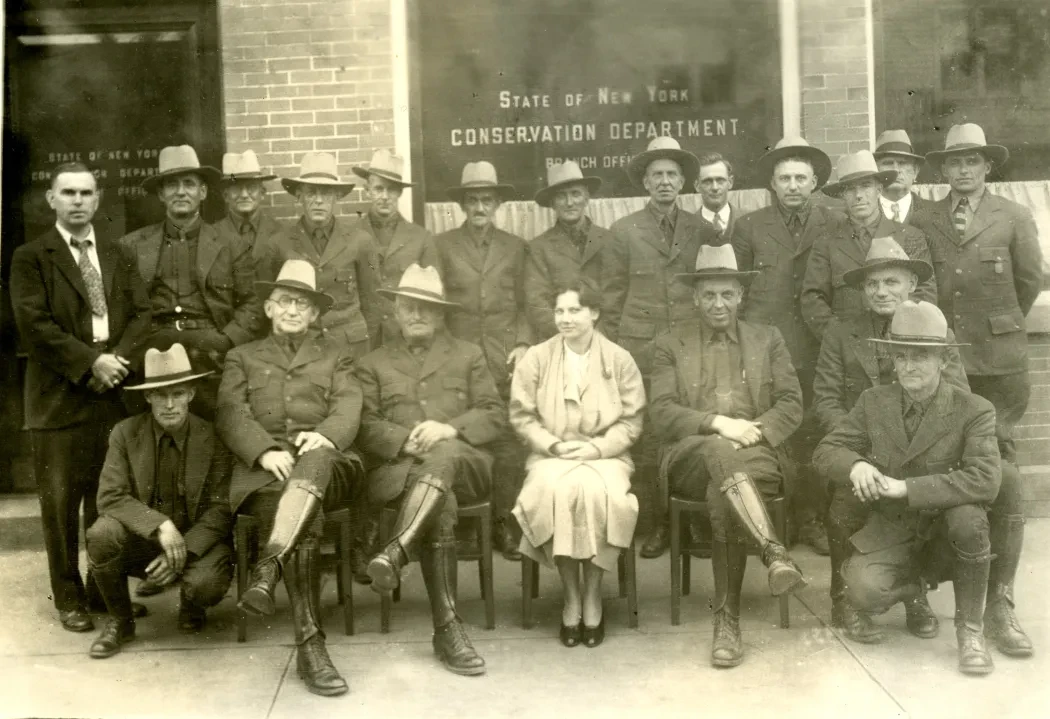 Female secretary posing for a group photo of all male Ranger force