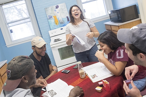 Union students enjoying a conversation in one of the campus houses.