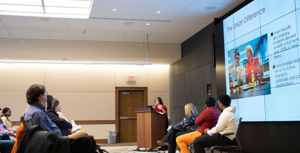 group of people watching a presentation