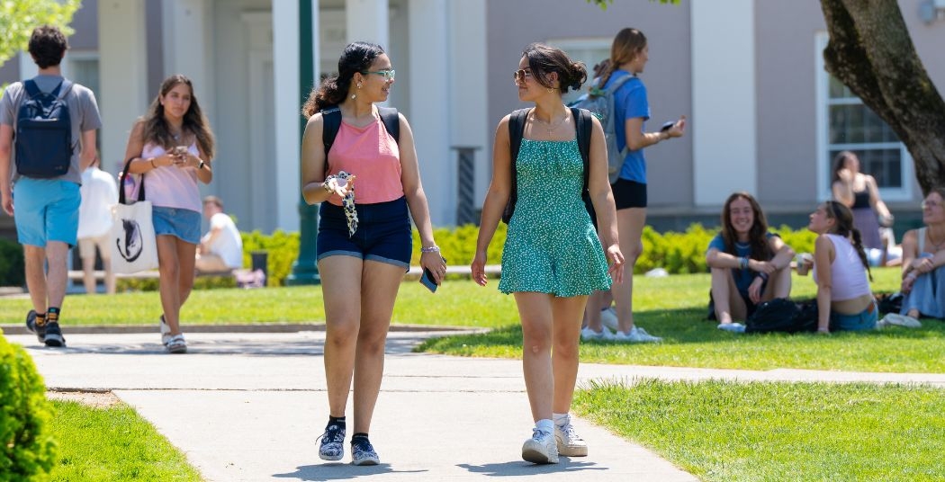 Students walking on campus in the summer
