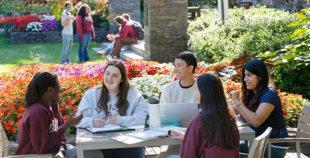 Students talking and studying outside Reamer.