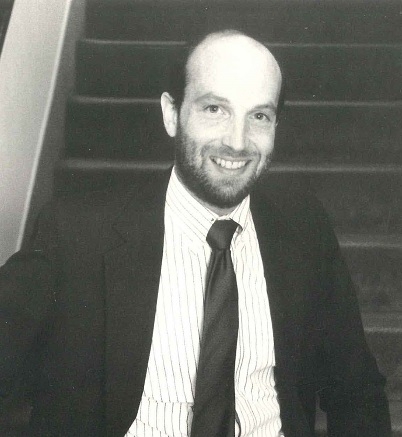 Larry Levitz in suit facing camera