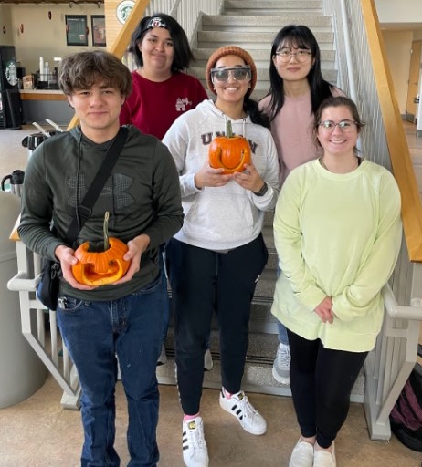Chem Club posing with pumpkins