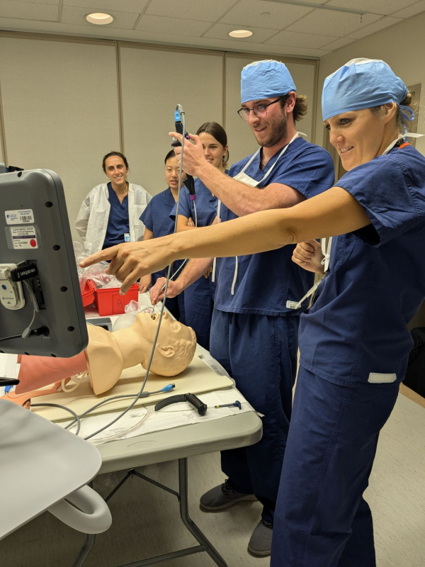 BME clinical immersion students working with an anesthesiologist in the simulation center to learn how biomedical technologies are used in the clinic.
