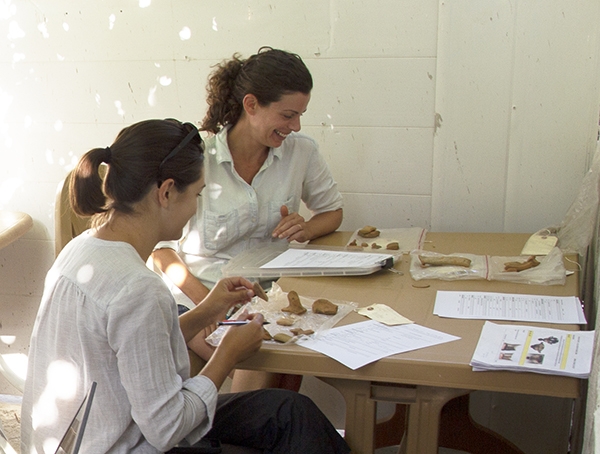 Dr. Angela Commito and University of Michigan Ph.D. student Christina Di Fabio record pottery collected in different survey units across the site.