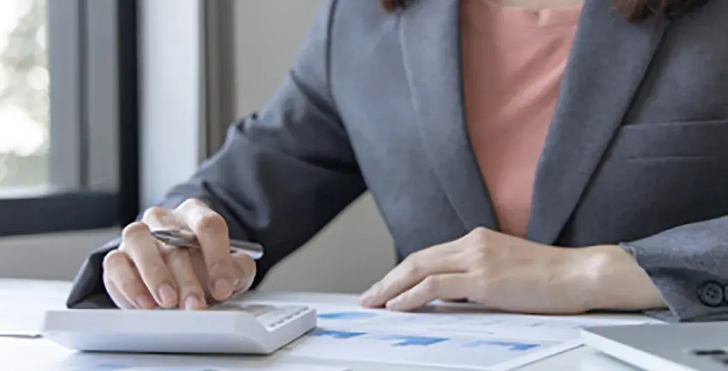A person working with a calculator