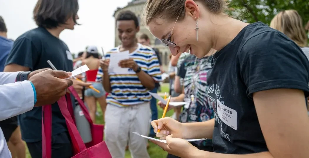 Incoming students at a welcome event on campus.