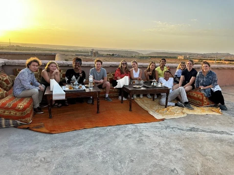 photo of students and Prof Batson enjoying the beautiful sunset in Morocco.
