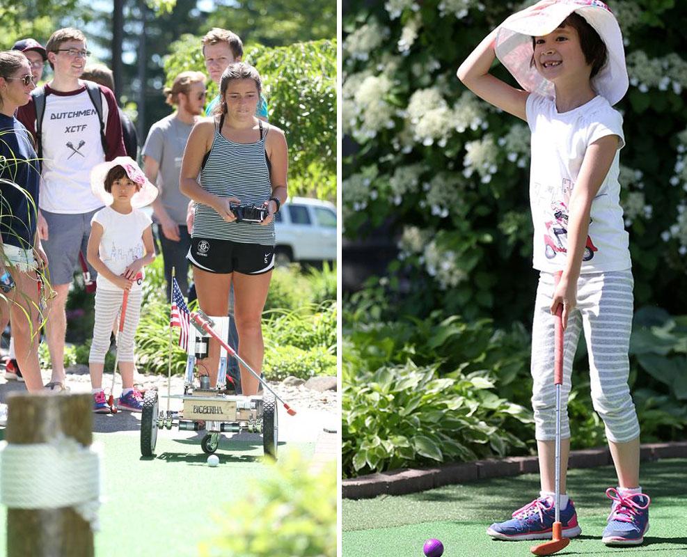 Gracie Keat, 6, tested her miniature golf skills against a trio of robots designed by students in a mechanical engineering class.