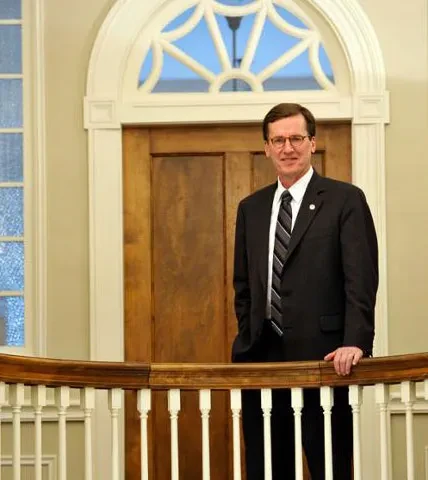 President Ainlay posing for a formal picture