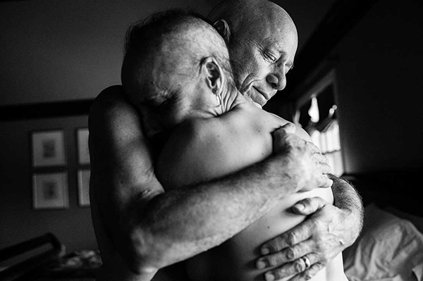 The embrace: Howie and Laurel Borowick embrace in the bedroom of their home. In their 34-year marriage, they never could have imagined being diagnosed with stage 4 cancer at the same time. Chappaqua, N.Y., March 2013