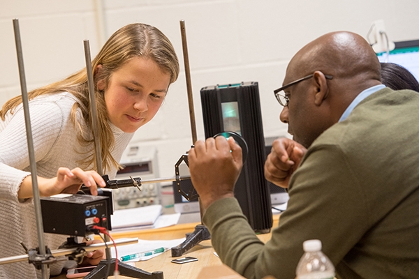 A Union student working on physics research with a professor