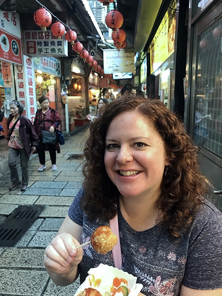 Krisanna M. Scheiter samples food in Jiufen, Taiwan.