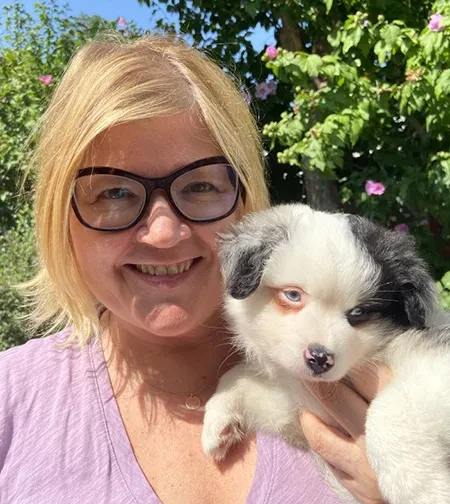 Lori Marso,&nbsp;the Doris Zemurray Stone Professor of Modern Literary and Historical Studies, with her puppy, Taki.