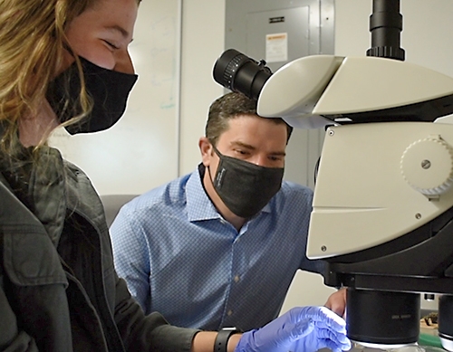 Scott Kirkton, associate professor of biology, with a student