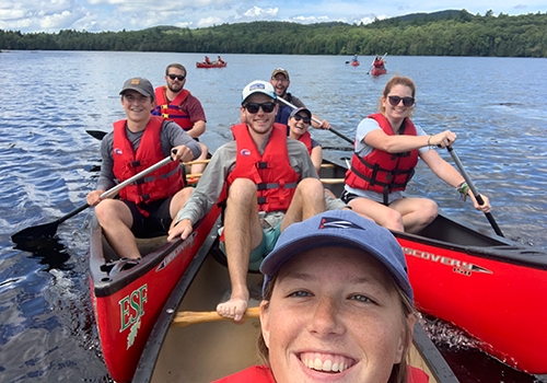 Union College students canoeing Rich Lake in the Adirondack mountains