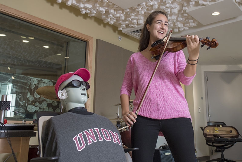 Christie Dionisos '19 in the phasor lab, a venue for research at the interface of electrical engineering and music