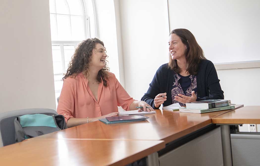 Professor Melinda A. Goldner talking with a student