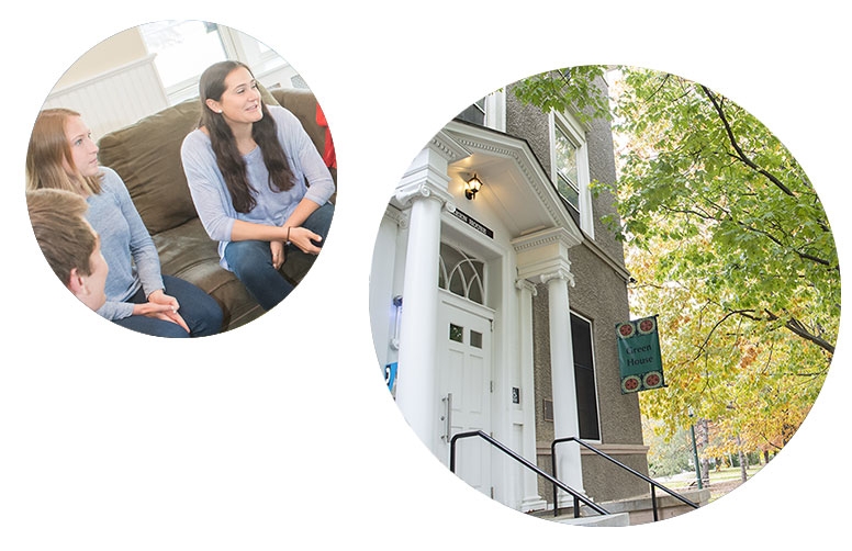 Photo shows the exterior of a Minerva House and students inside the house talking.