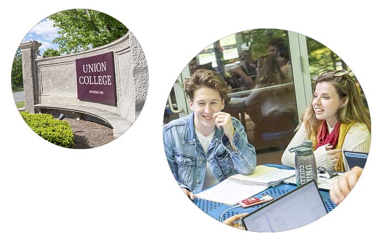 The Union College sign and students sitting at a table talking to one another.