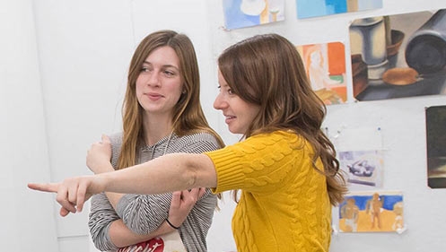 Visual arts professor Laini Nemett with a student