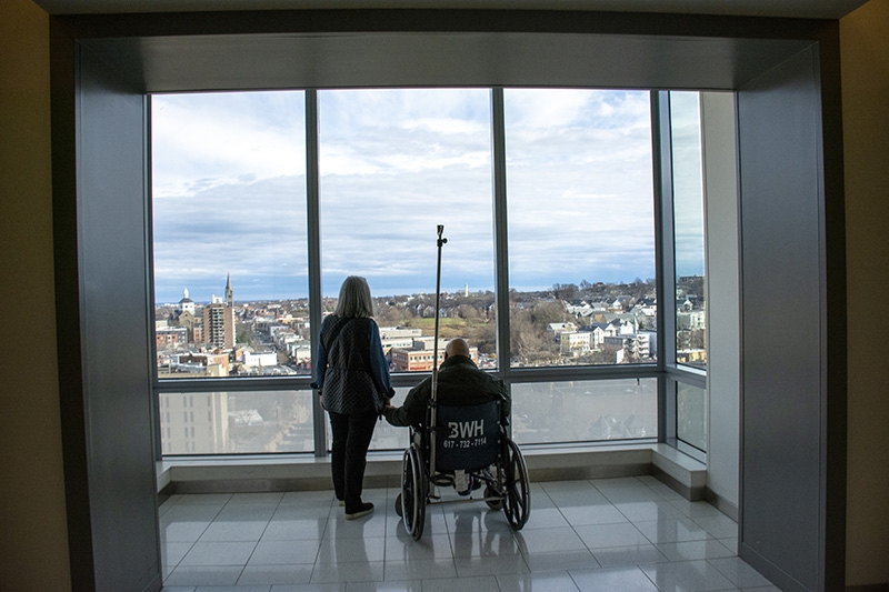 A photograph of two people in hospital setting