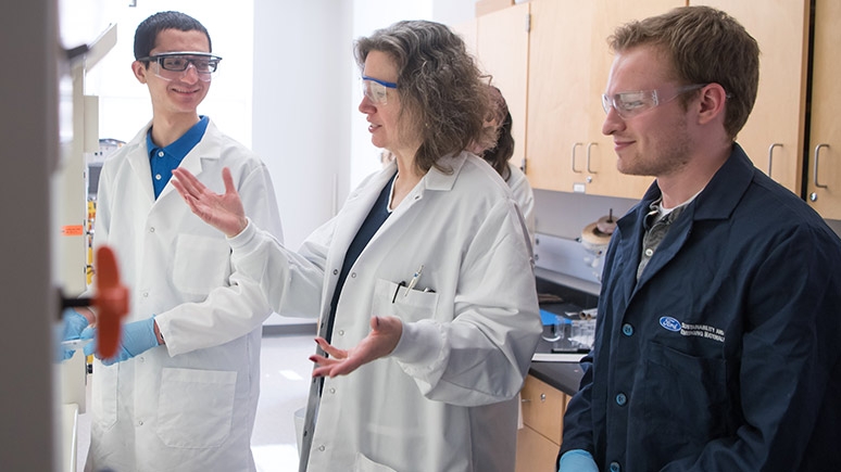 Mary Carroll '86, the Dwane W. Crichton Professor of Chemistry, works with Chris Avanessian '21 and Thomas Andre '20 (right).