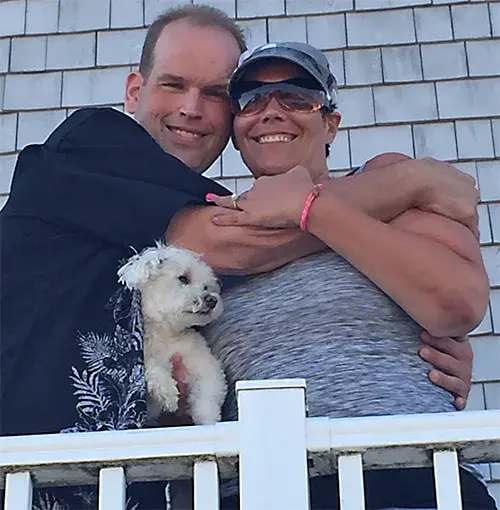 Dennis Chotkowski and wife, Kristin, with their dog, Piccolo