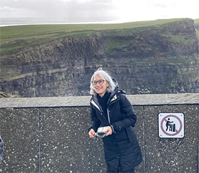 Joyce Madancy, professor of history, at the Cliffs of Moher