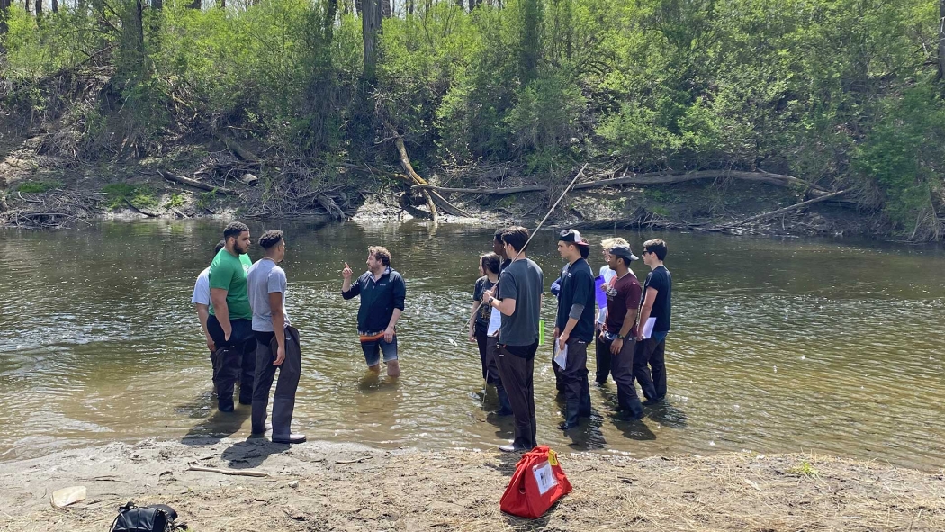 A geology class explores a local stream