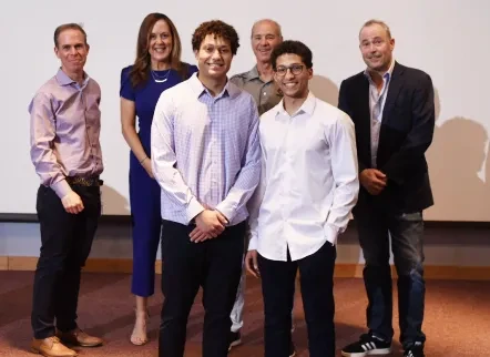 Twins Sean and Justin Regis '23, winners of the pitch competition, with judges&nbsp;Tony Versaci ’91,&nbsp;Catharine Potvin ’97, Michael Esposito ’72 and Thomas Coleman '88.