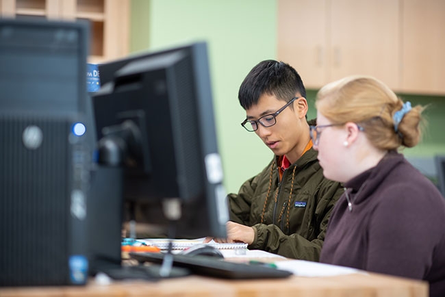 Students in front of a computer screen