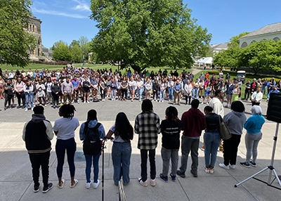 Students light 10 candles, one for each victim of the Buffalo shooting