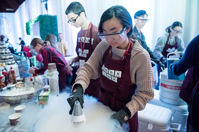 Photo shows Chemistry Club members making liquid nitrogen ice cream.