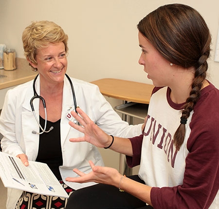 A Union College nurse speaking with student