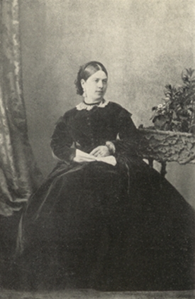 Bigelow woman in photo sitting in chair