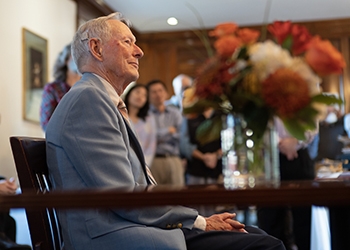 Prof. Donald Thurston listens as colleagues reflect on his influence at the College