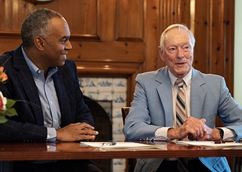 President David Harris, left, and Donald Thurston at a Nov. 1 reception in honor of the professor