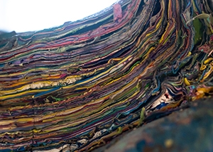 A cross-section show layers of paint on the Chinese stone lion