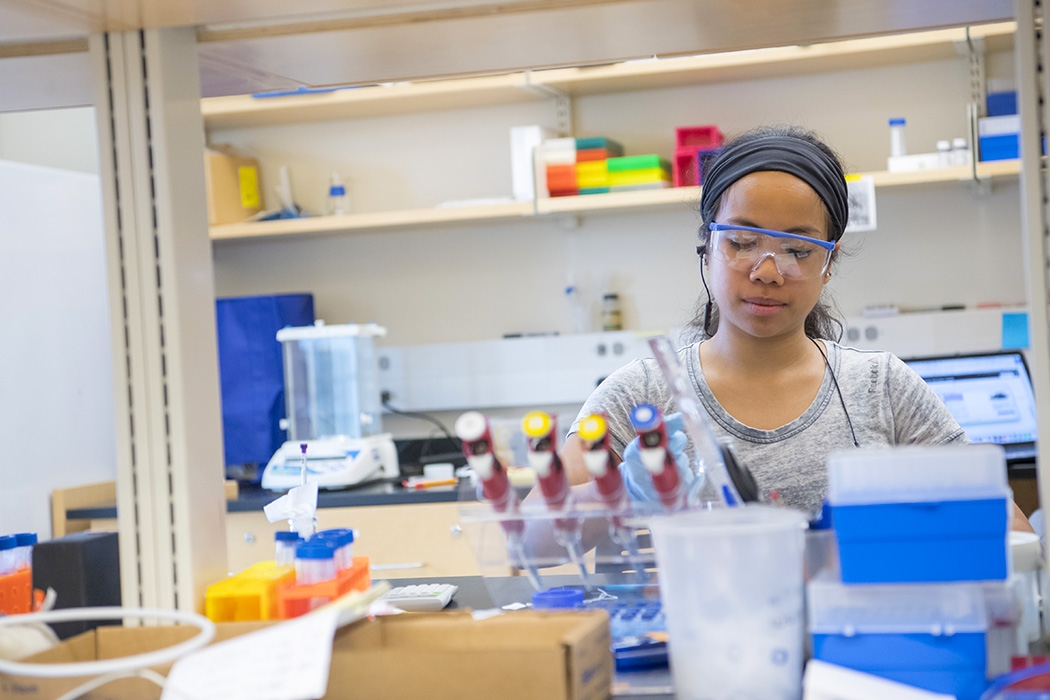 A student conducting research in one of the biochemistry suites.