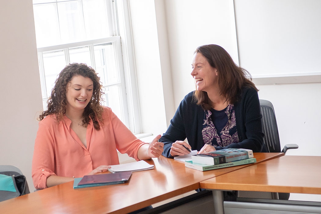 Melinda Goldner meeting with a student in Lippman Hall.