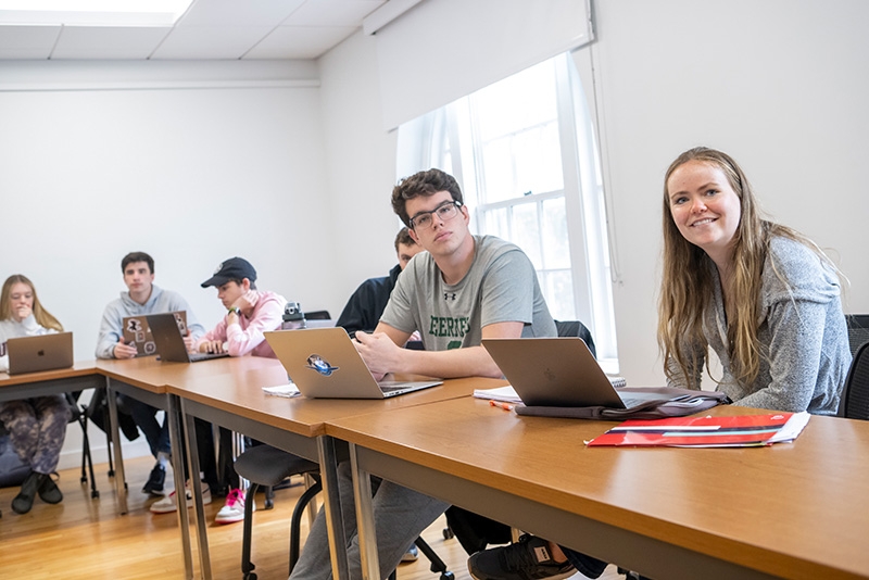 A student in a Karp Hall classroom answers one of the professor's questions