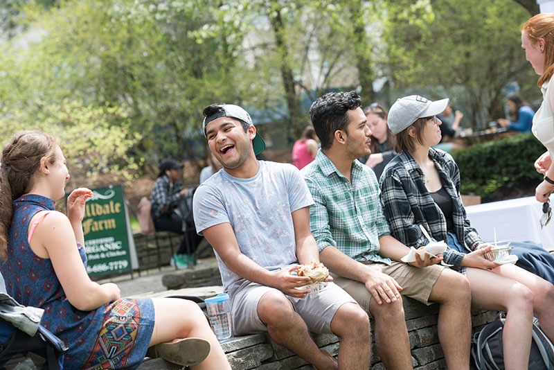 Students sitting on backwall of Reamer Campus Center